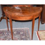 A George III Mahogany Demi-Lune Foldover Tea Table, with crossbanding, 92cm by 45cm by 73cm