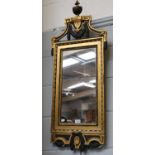 A Wall Mirror, 19th century, later painted and gilt, with mercury frame and urn and swag surmount,