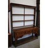 An Oak Dresser and Rack, 18th century, the base fitted with five drawers and a pot board