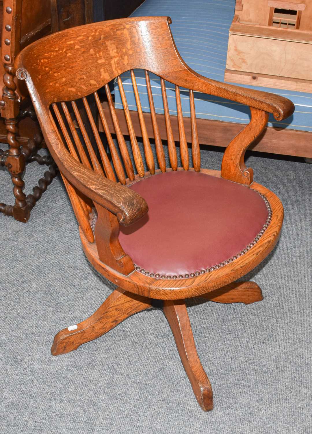 An Oak Swivel Desk Chair, early 20th centuryThe chair has a mechanism but it is not in operation.