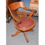 An Oak Swivel Desk Chair, early 20th centuryThe chair has a mechanism but it is not in operation.