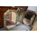 A Pair of Octagonal Painted and Gilt Framed Wall Mirrors, with bevelled plates, 79cm by 107cm,