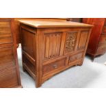 A Modern Linen Fold Carved Oak Blanket Chest, the front with press carved central panel fitted