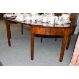 A George III Mahogany D End Dining Table, with additional leaf, raised on plain square supports,