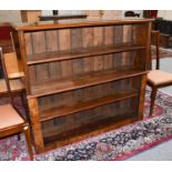 An Open Bookcase, converted from an upright piano, 134cm by 33cm by 120cm