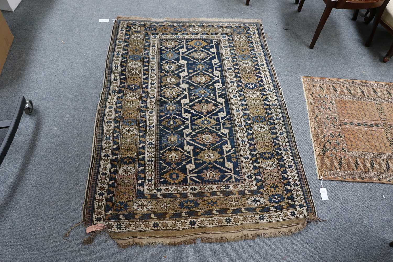 A Kuba Rug, the indigo field with two rows of stylised flowerheads enclosed by Harshang borders, - Image 2 of 3