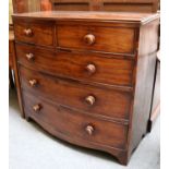 A Bowfront Mahogany Four Height Chest of Drawers, 19th century, 107cm by 53cm by 100cm