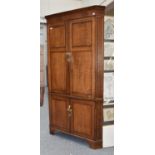 A Panelled Oak Standing Corner Cupboard, early 20th century, 115cm by 64cm by 214cm