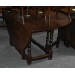 An Oak Gateleg Dining Table, 18th century, on barley twist supports, with moulded bar stretchers and