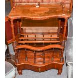 A Victorian Rosewood Whatnot, serpentine fronted and with brass galleried top, with base drawer,