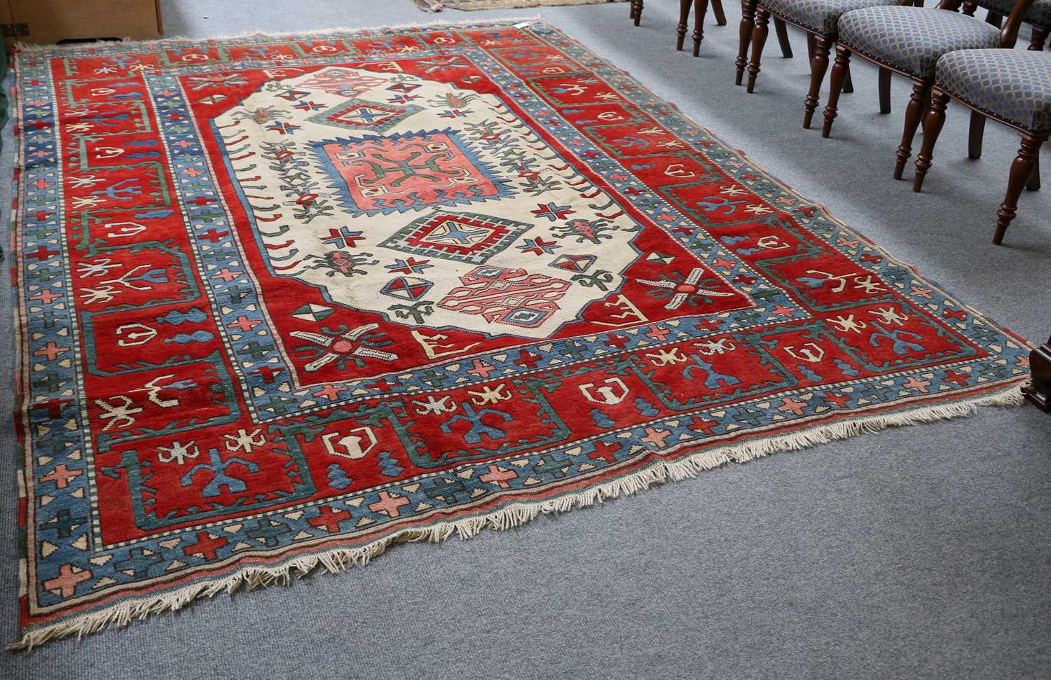 Turkish Carpet, the ivory lozenge field of geometric motifs framed by wide blood-red borders, - Image 2 of 2