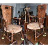 A Pair of Rush Seated Armchairs, in the Arts & Crafts taste, with sea dragon carved ball supports