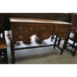 An Oak Dresser Base, 18th century, of small proportions, 127cm by 38cm by 82cmTwo ring marks to