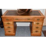 An Oak Leather Inset Writing Desk, early 20th century, 121cm by 60cm by 70cm