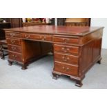 A Red Leather Inset Mahogany Pedestal Partner's Desk, circa 1900/1910, bearing ivorine label Cooke's