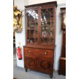A George III Crossbanded Mahogany Secretaire Bookcase, on turned legs, 109cm by 55cm by 242cm