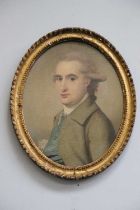 Follower of Gainsborough Dupont (1754-1797)Portrait of a gentleman, bust length, in a blue waistcoat