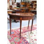 A George III Mahogany Demi-lune Fold Over Tea Table, with crossbanding, 92cm by 45cm by 74cmTop with