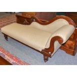 A Victorian Mahogany Framed Chaise Longue, on turned supports moving on castors, 185cm long