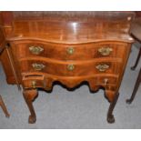 A Walnut Serpentine Four Drawer Side Table, 19th century, raised on shell carved cabriole supports