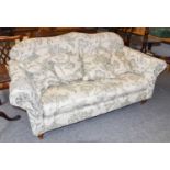 A Wesley-Barrell Two Seater Sofa, in leaf print upholstery, 180cm wide by 93cm by 95cmEstimate £