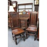 A Pair of Highback Oak Chairs, late 17th century, with plank seats and turned supports Provenance: