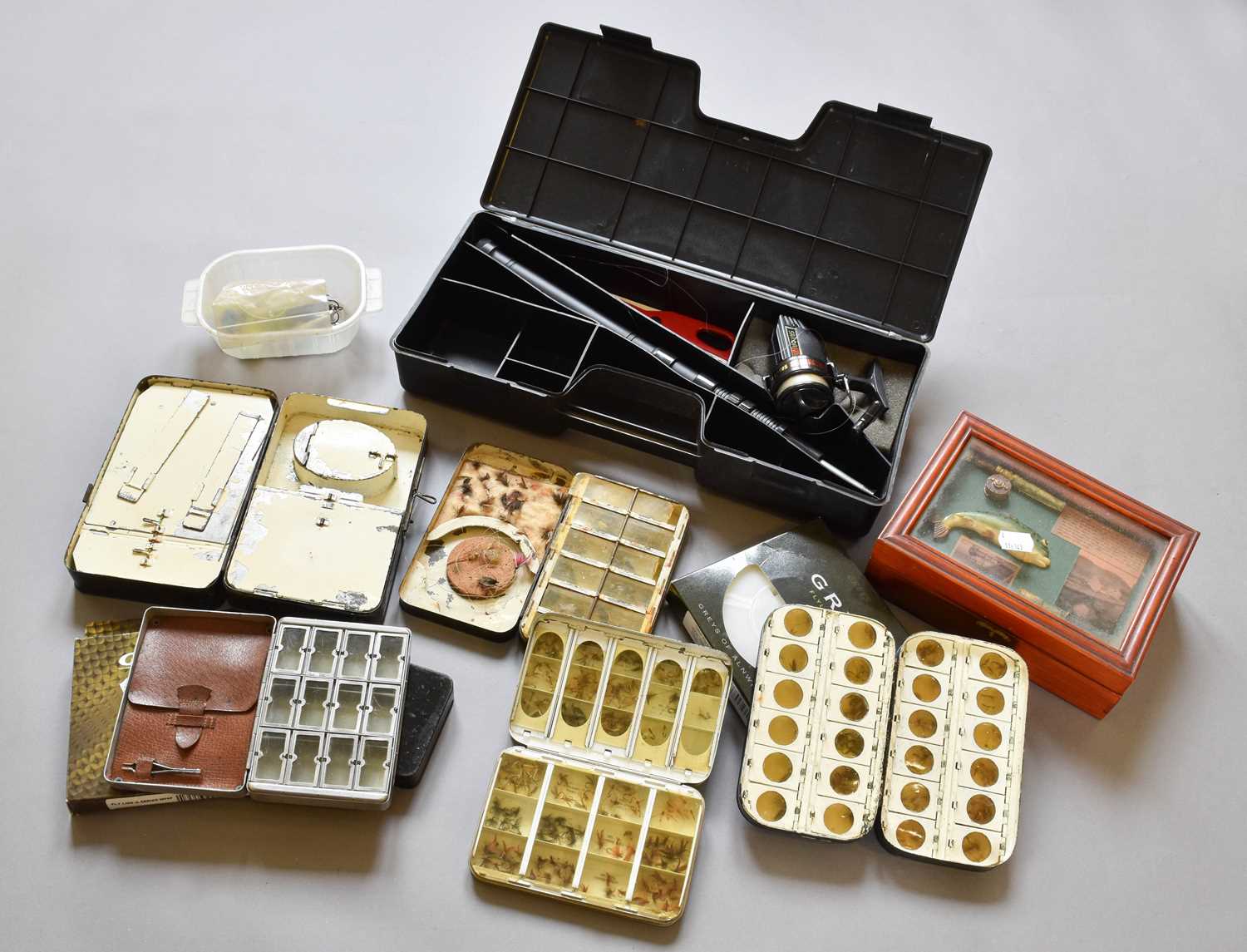 A Collection Of Various Fly Boxes And Accessories