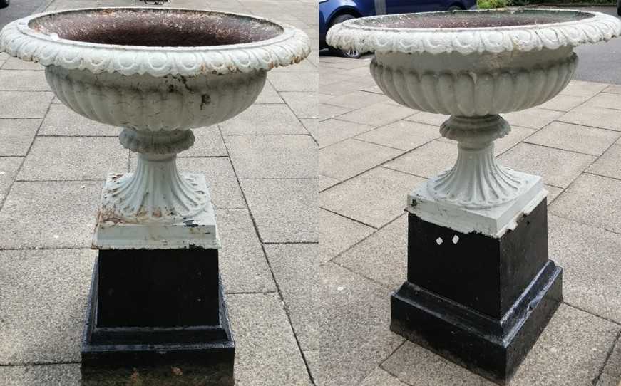 A Pair of Victorian White Painted Cast Iron Garden Urns, of fluted campana form with gadrooned