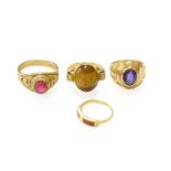 Four Gem-Set Rings Including, a synthetic ruby example, a tiger's-eye example, a coral example