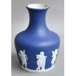 A Wedgwood Blue Jasperware Vase, together with two Nao figures of golfers, two Capodemonte
