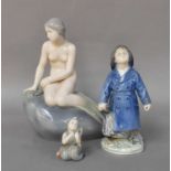 Royal Copenhagen, a figure of a Mermaid, model No. 7731, Fisherboy, model No. 3556, and a small