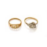 An 18 Carat Gold Diamond Five Stone Ring, finger size M1/2; and A Diamond Three Stone Twist Ring,