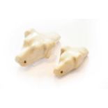 Two 19th-Century Staffordshire Porcelain Dog Whistles, circa 1860, each one modelled as a hounds