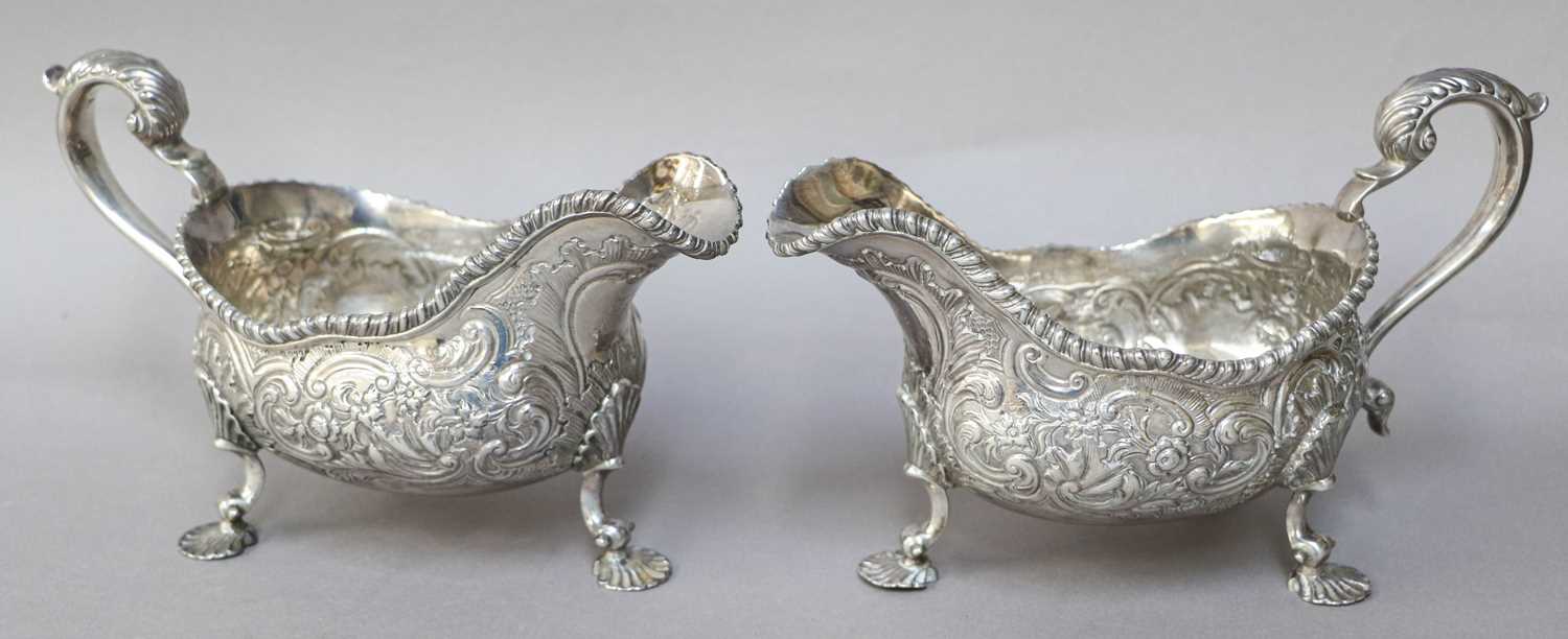 A Pair of George III Silver Sauceboats, Marks Worn, Probably London 1784, each oval and on three