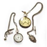 A silver open Faced pocket watch by Waltham with a silver curb link watch chain and attached