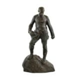 After Gerhard Adolf Janensch (1860-1933): A Bronze Figure of a Soldier, standing on a rocky