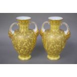 A Pair of Royal Crown Derby Twin Handled Mask Vases, circa 1884, yellow ground and decorated in gilt