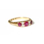 An 18 Carat Gold Synthetic Ruby and Diamond Ring, finger size K1/2Gross weight 3.4 grams.