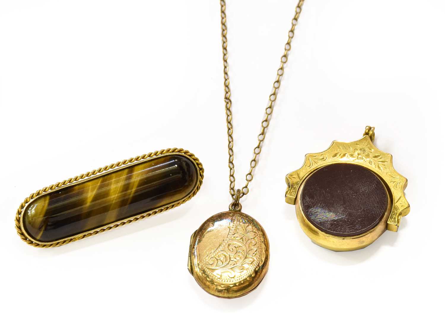 A 9 Carat Gold Hardstone Swivel Fob; A Tiger's-Eye Bar Brooch, stamped '9CT', length 4.3cm; and A