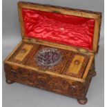 An Ornately Carved Tea Caddy, Victorian, with two compartments and glass mixing bowl, 38cm by 20cm