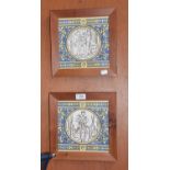 A Framed Pair of Mintons Tiles, each printed with a scene of a woodsman under pale yellow and blue