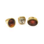 Three Intaglio Rings, finger sizes Q, V and XTwo hallmarked 9 carat gold - 16.8 grams. One