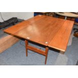 A 1960s Danish Teak Metamorphic System Table, designed by Kia Kristiansen, made by Patentanm, the