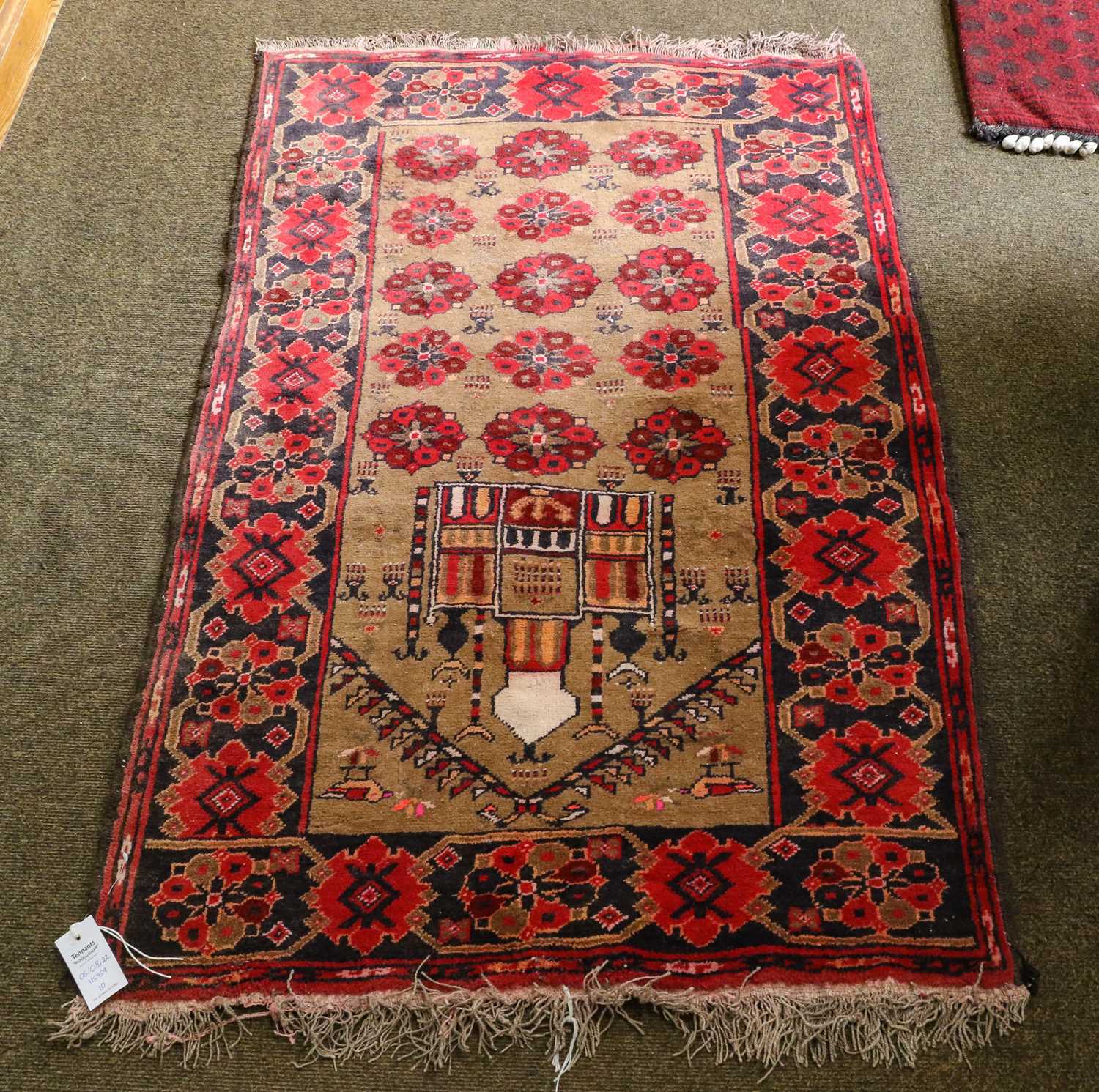 An Afghan Prayer Rug, the camel field with a mosque enclosed by harshang borders, 130cm by 84cm;