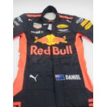 A 2017 Daniel Ricciardo Signed Formula One Red Bull Racing Suit, with certificate of authenticity