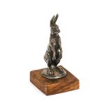 A 1920's Alvis Car Mascot, in the form of a hare standing on its rear legs, with circular base