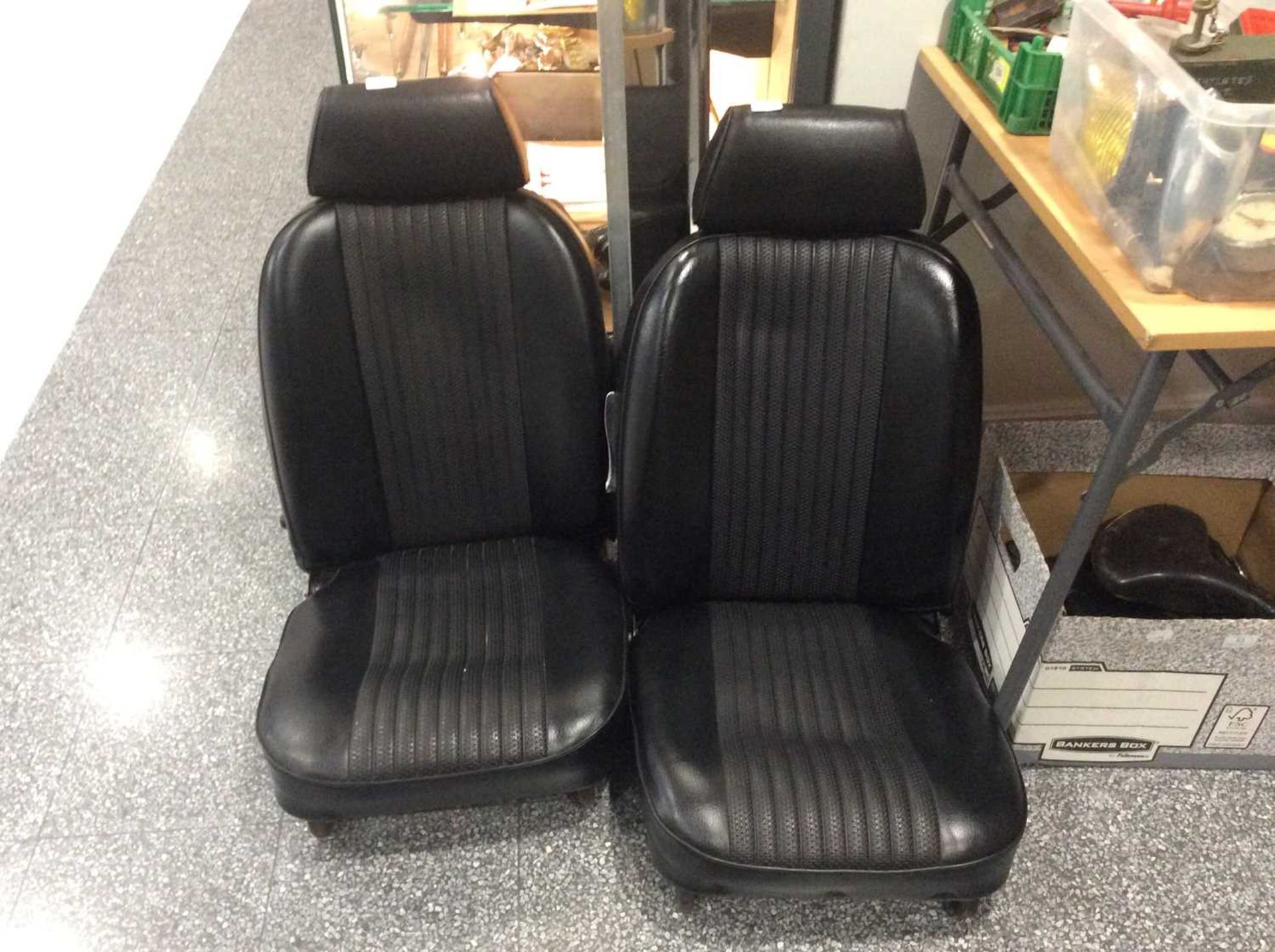 A Pair of Black Vinyl Covered Car Seats, suitable for an MG or similar vehicle and a pair of chromed