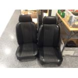 A Pair of Black Vinyl Covered Car Seats, suitable for an MG or similar vehicle and a pair of chromed