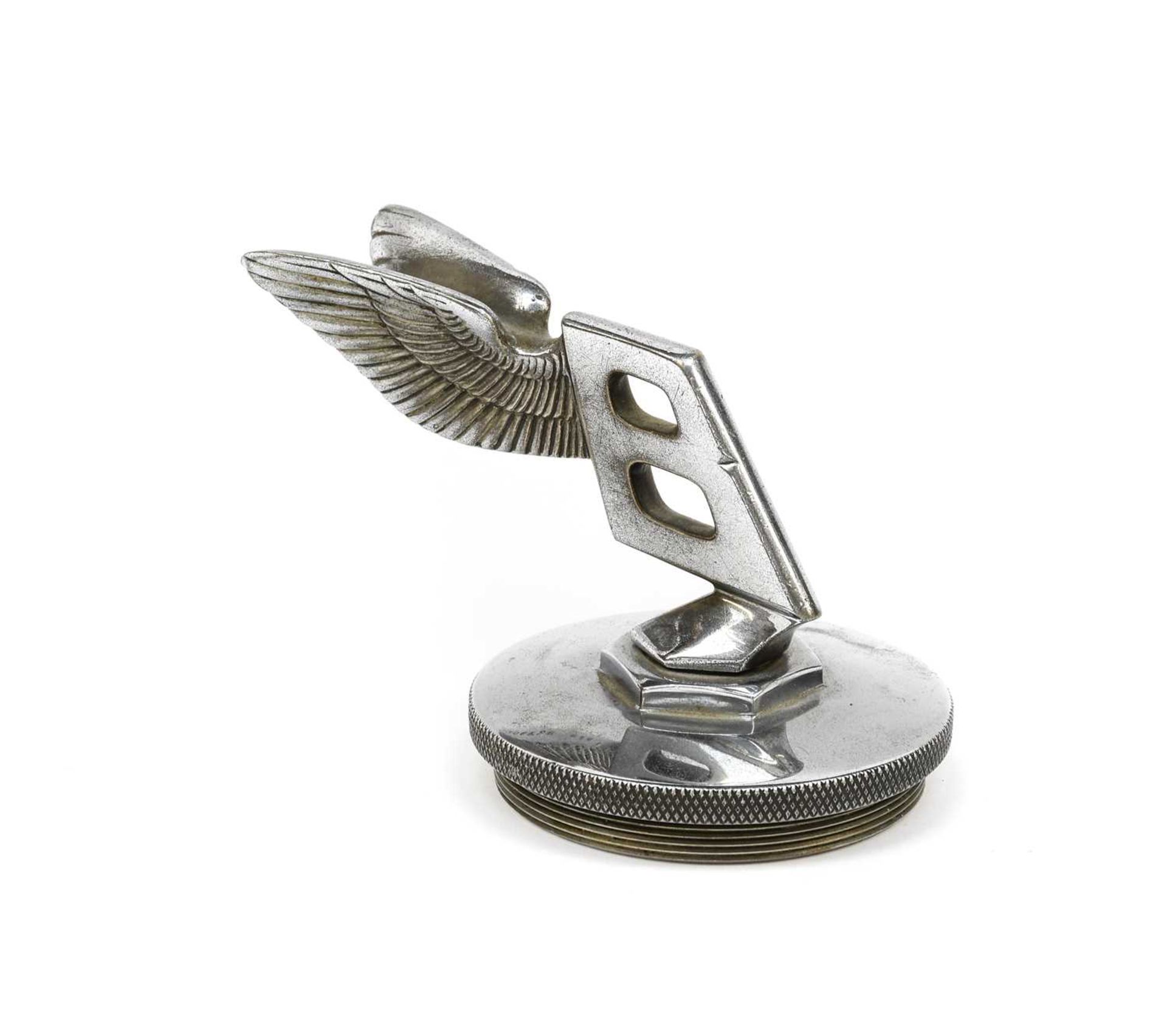 A Bentley Winged Chrome Car Mascot, mounted on a circular radiator cap, 9cmStamped registration