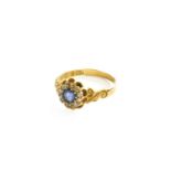 An 18 Carat Gold Sapphire and Diamond Cluster Ring, finger size PGross weight 3.1 grams.
